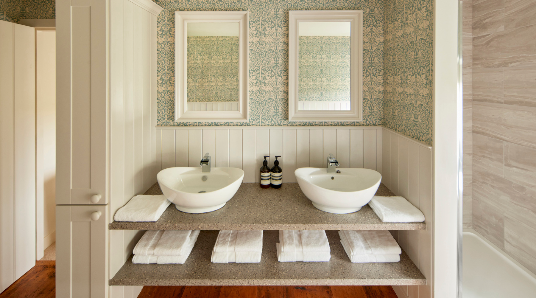 Omaze Million Pound House Lake District - white basins and mirror in bathroom