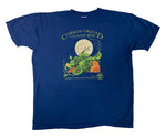 A navy shirt with artwork in the center depicting a praying mantis standing on a green and orange pumpkin patch in front of a large full moon. Lime green text around art reads “Common Ground Country Fair” and  “Celebrate Rural Living with MOFGA”. A lime green MOFGA logo is in the bottom right corner. 