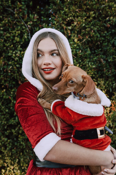 Woman-and-dog-wearing-a-santa-costume