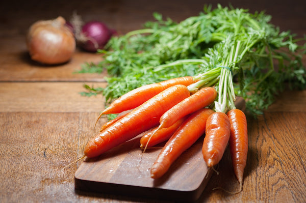 Healthy carrots being prepared for a pet