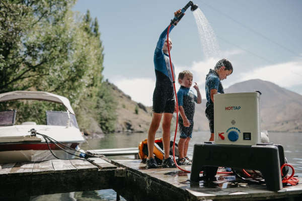 kids on pier have fun with HOTTAP shower 