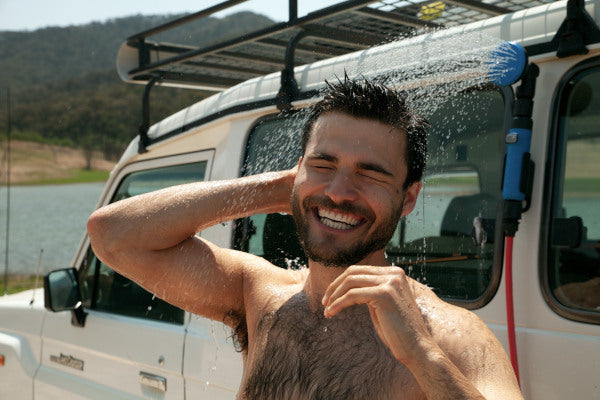 Man using HOTTAP vehicle-mounted showerhead