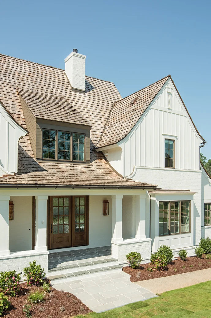 White home with cedar roof