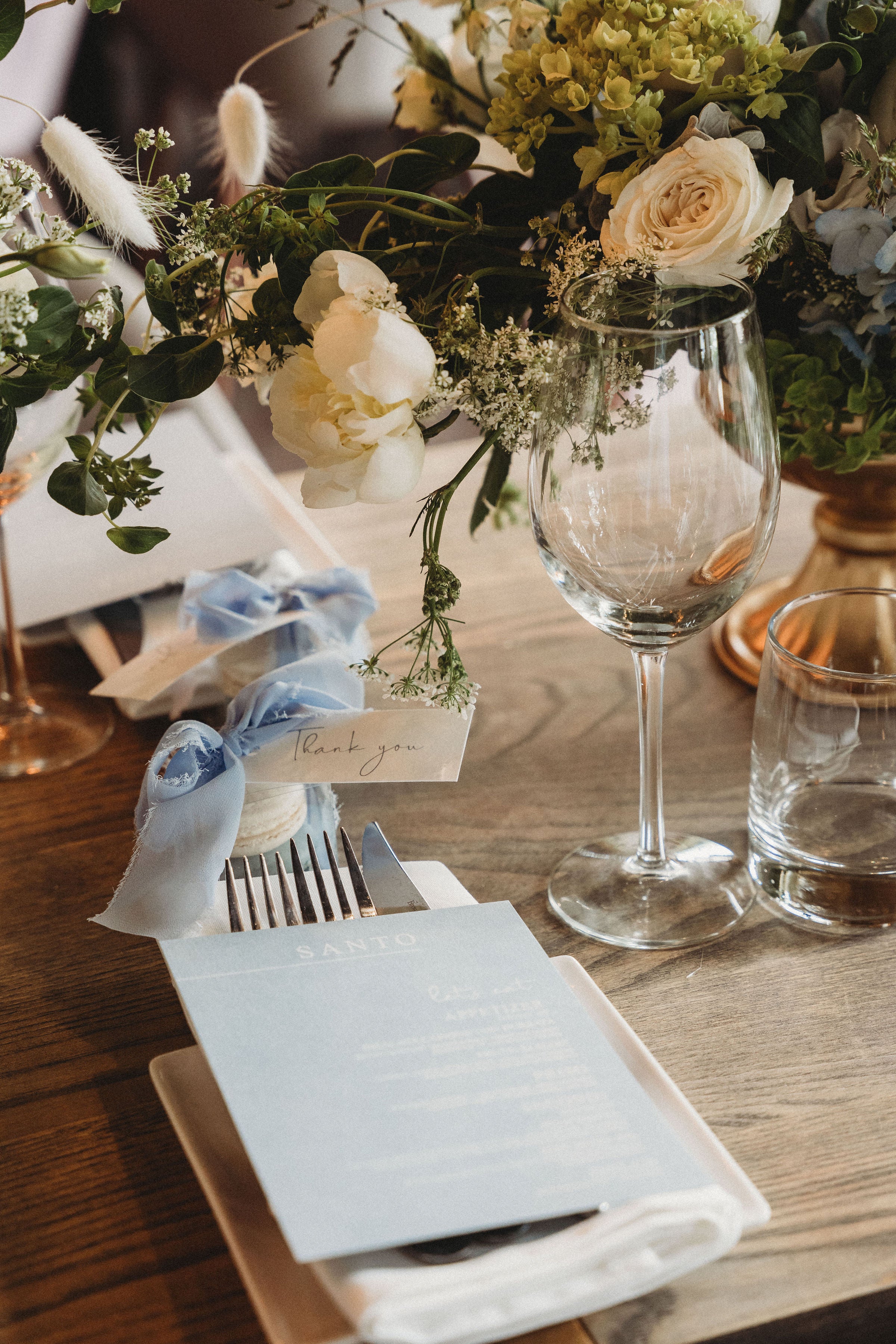 place setting with menu and flowers