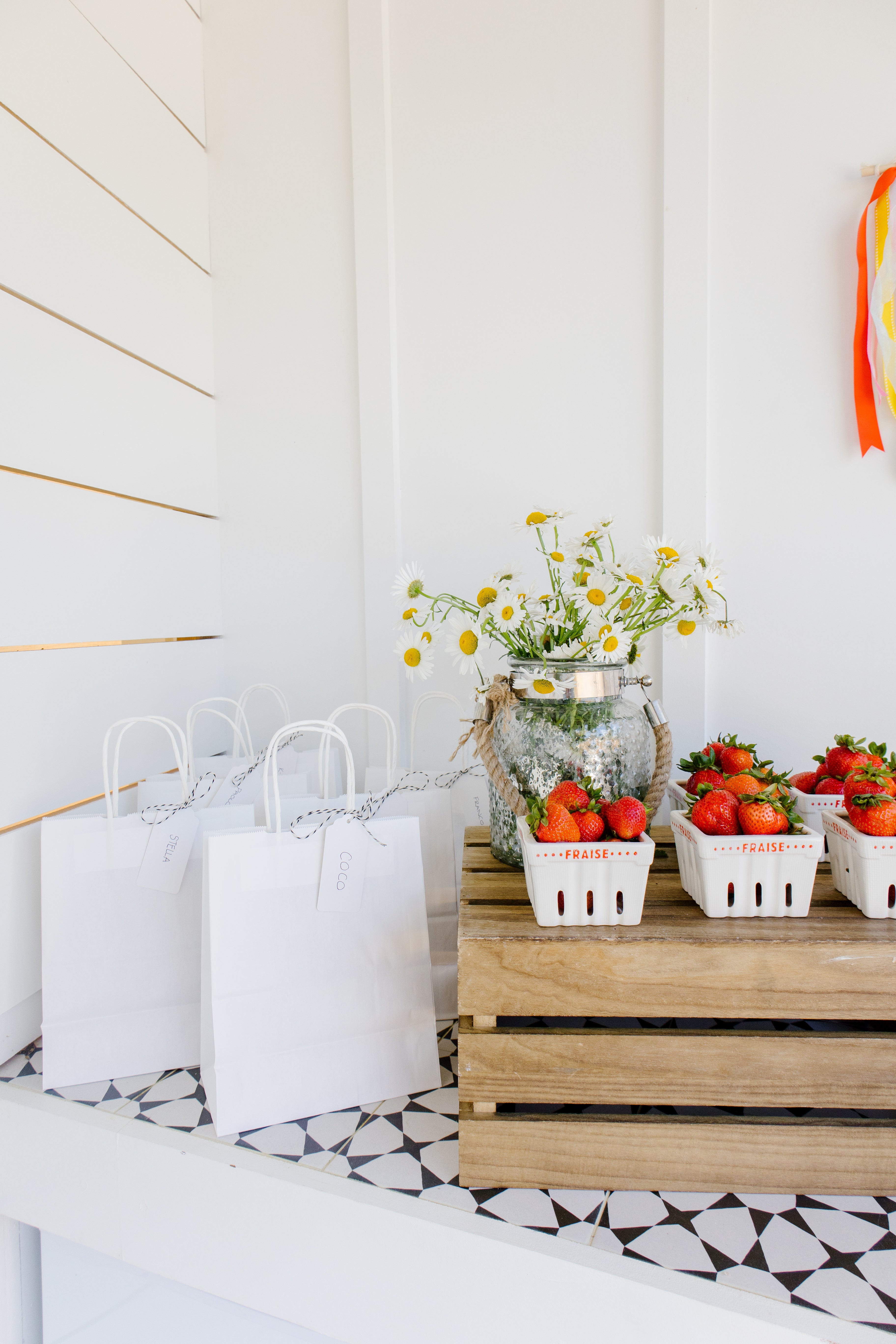 strawberries in vintage containers and birthday cake