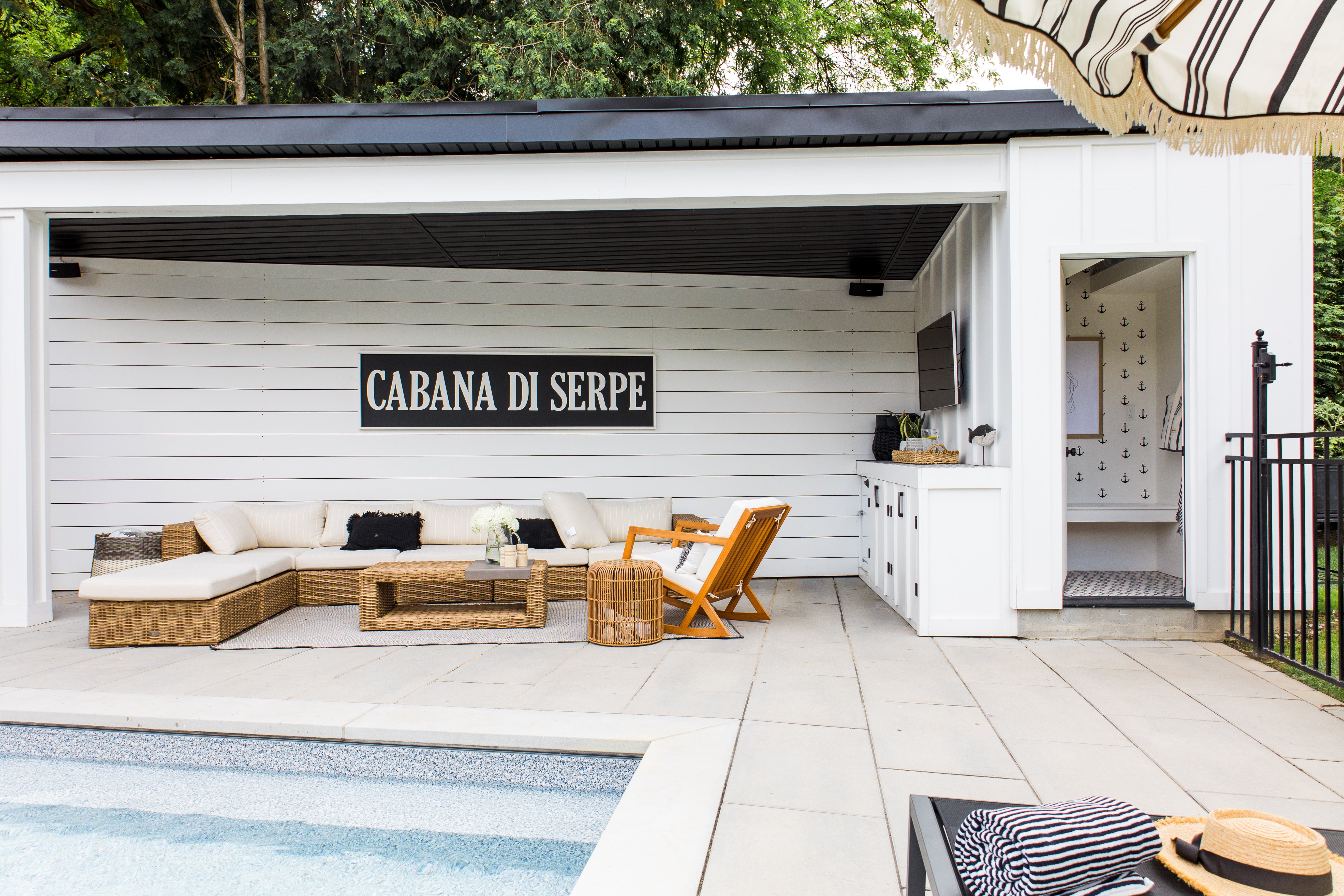 outdoor cabana with lounge area and change room