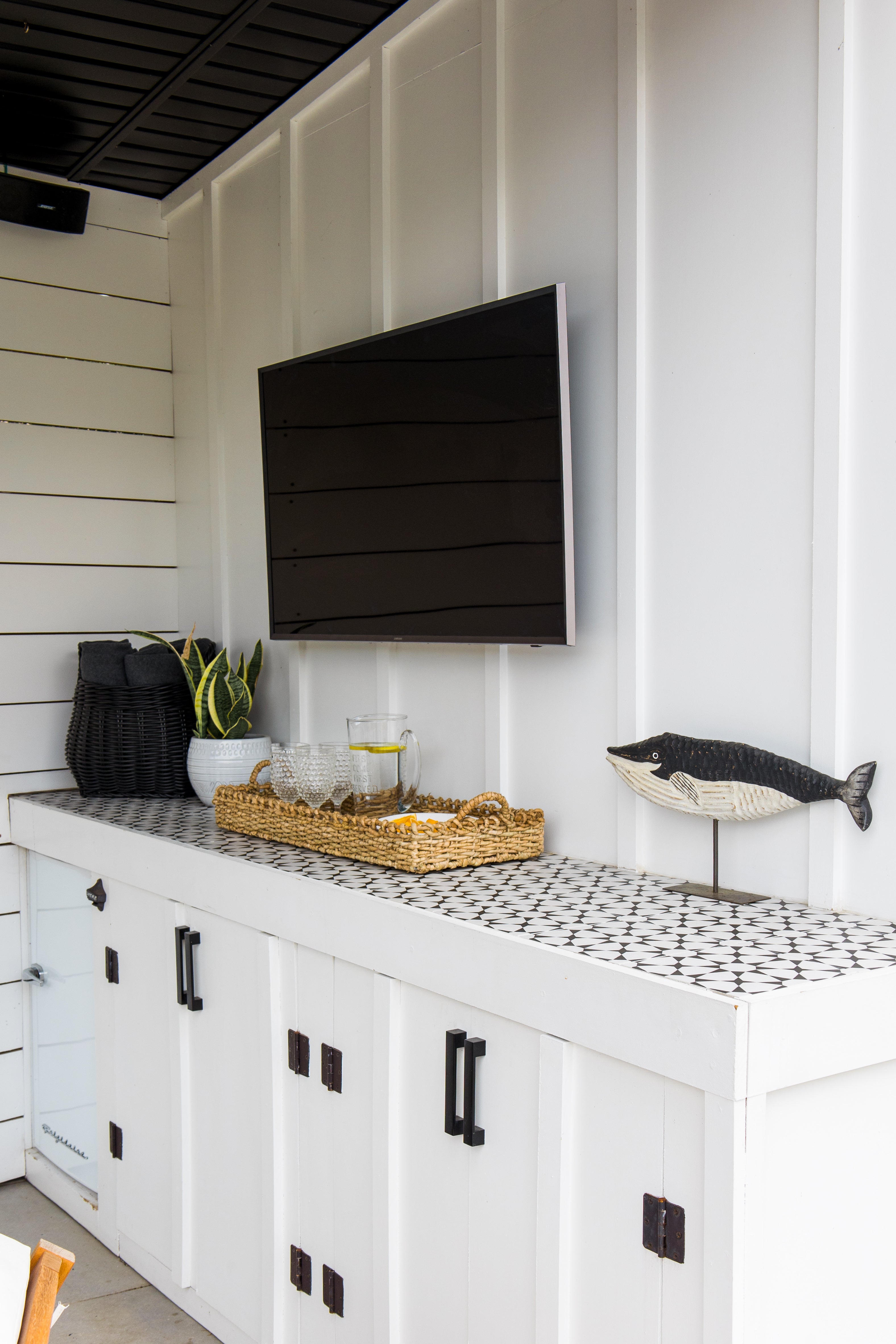 Outdoor counter with TV and decor