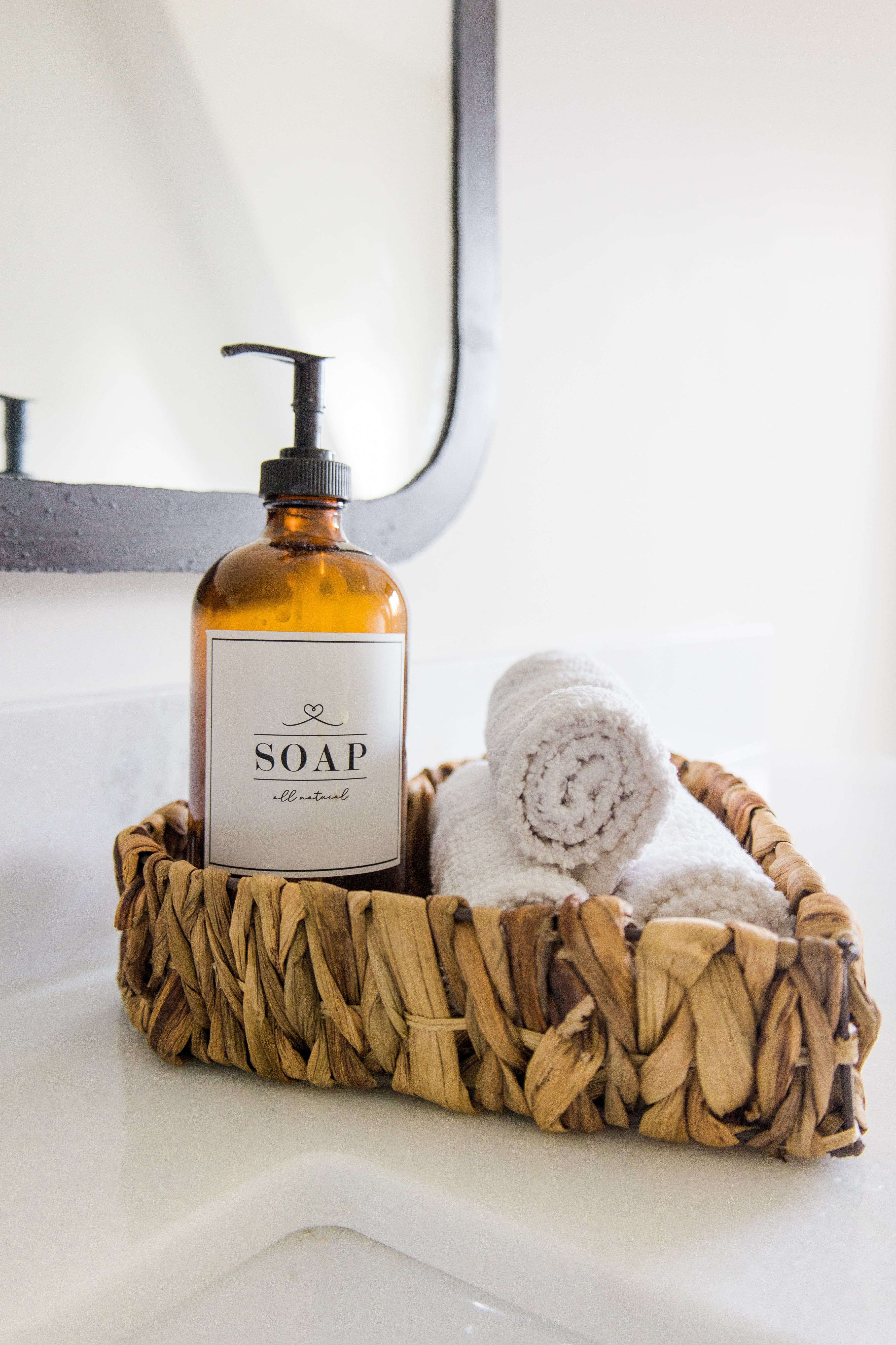 woven basket filled with soap and hand towels