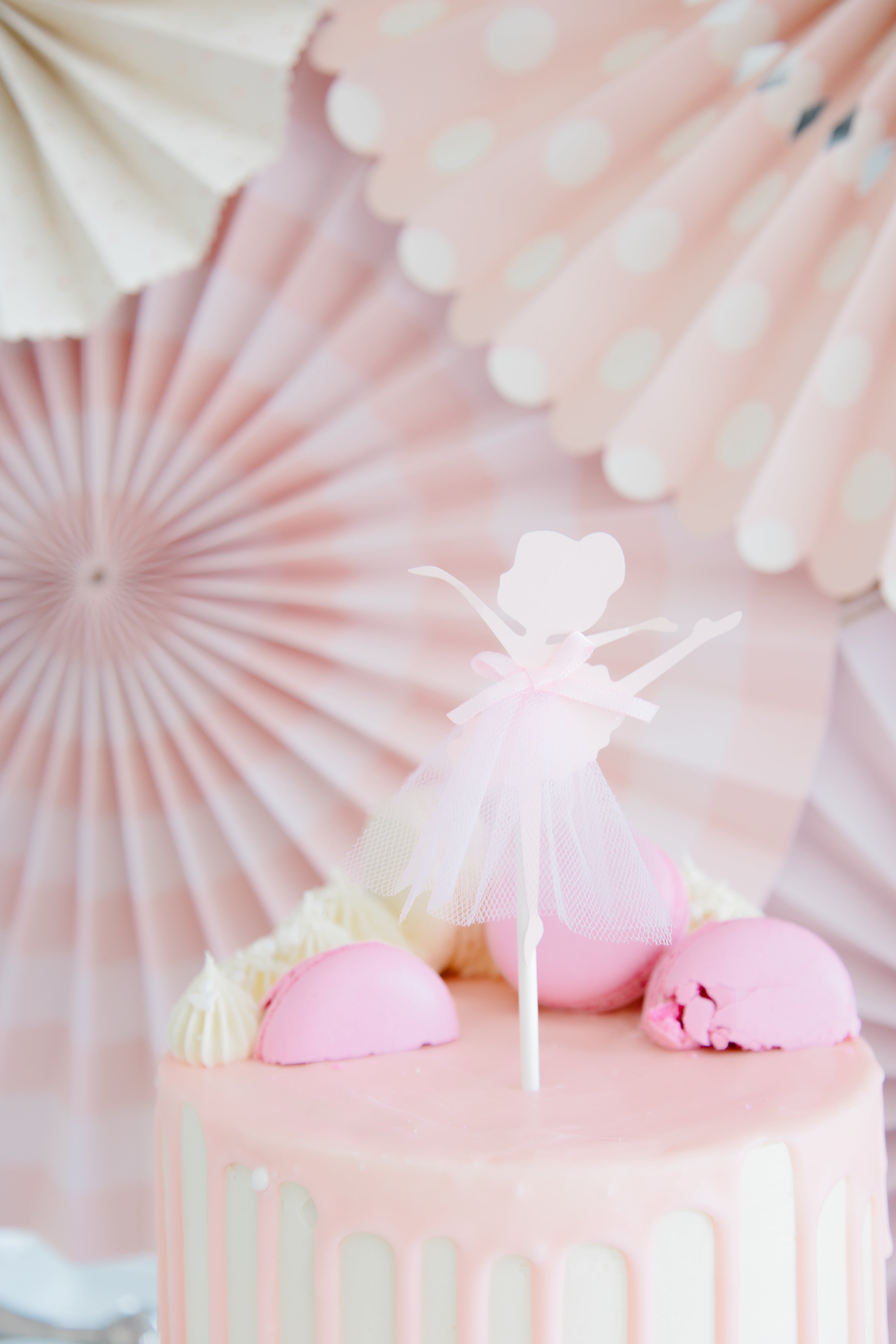 Pink cake with ballerina cake topper