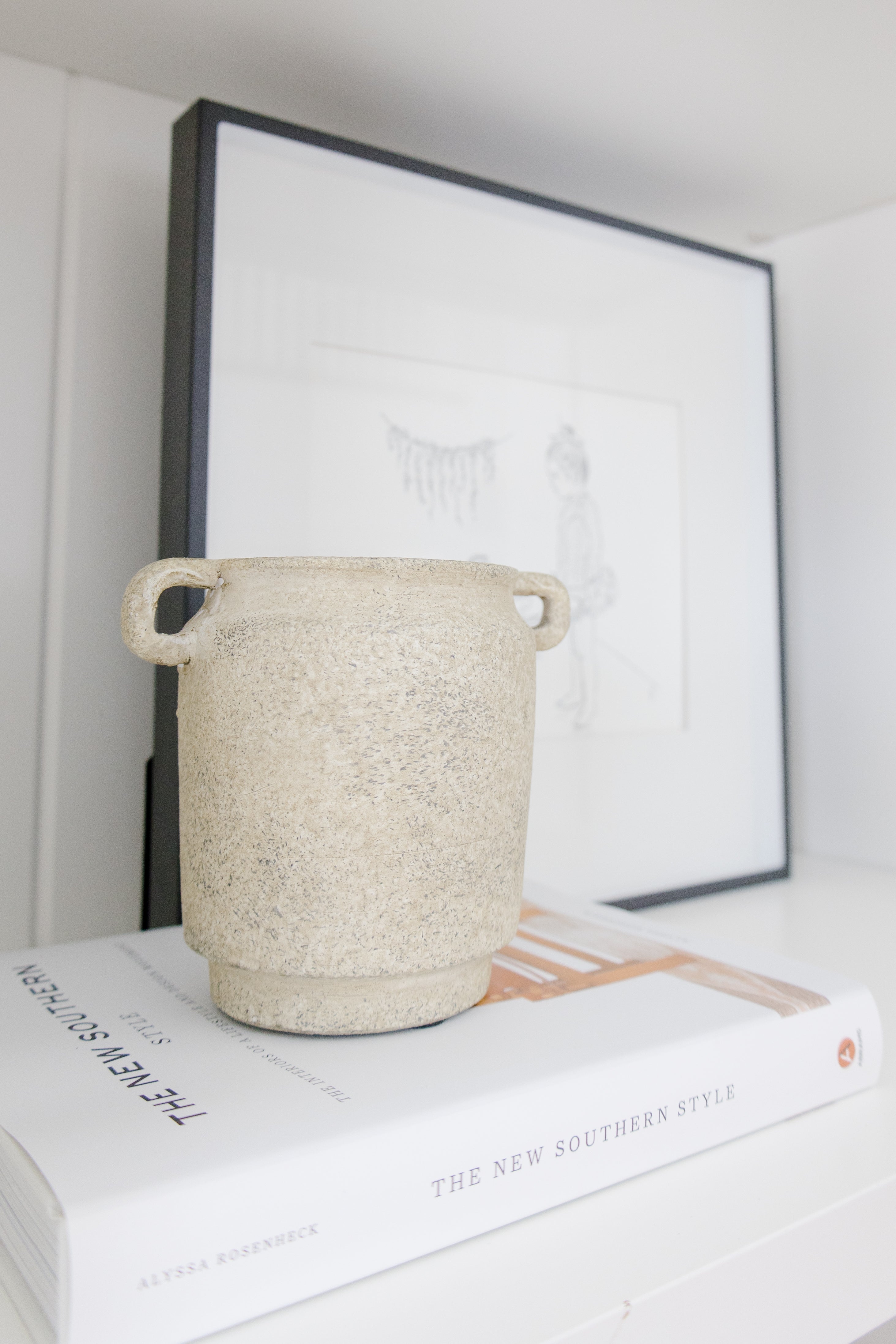 vase on top of coffee table book