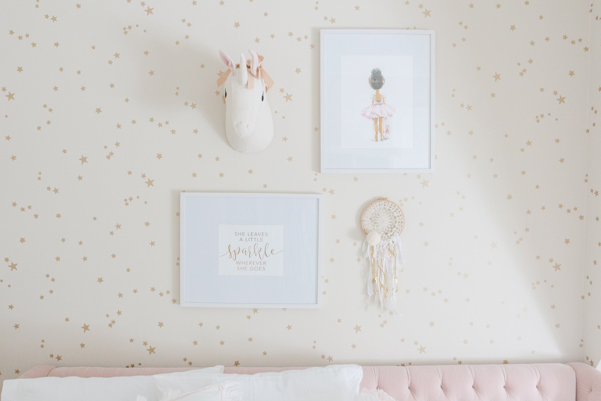 Girl gallery wall with unicorn head decor and dream catcher