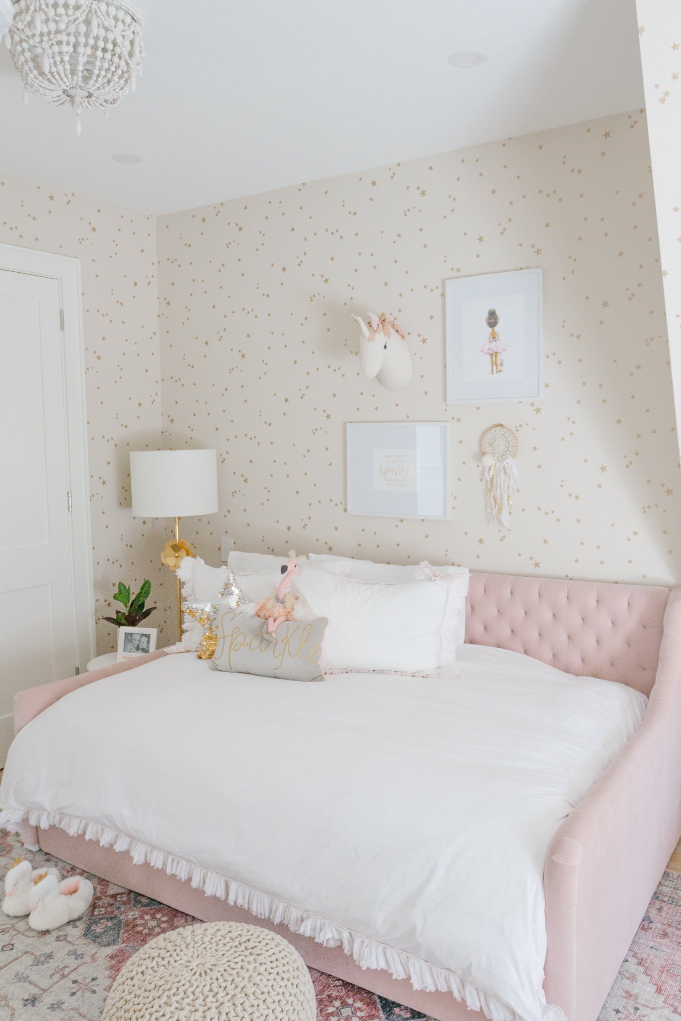 big girl bedroom with pink tufted bed