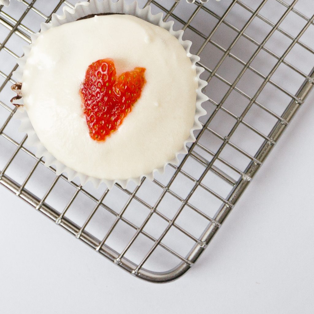 Cupcake with strawberry heart on top