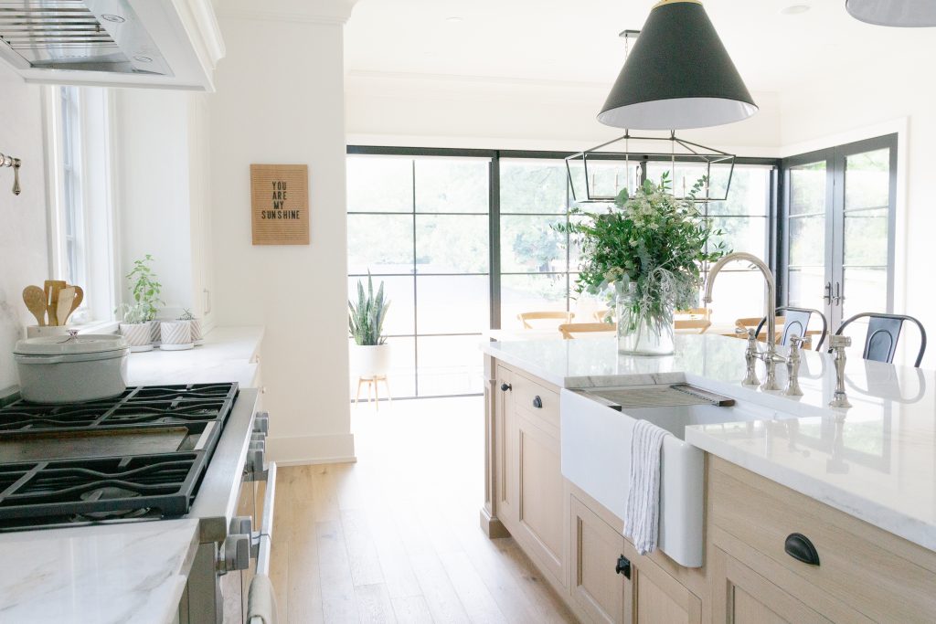 White oak kitchen with Miele range and fireclay farmhouse sink