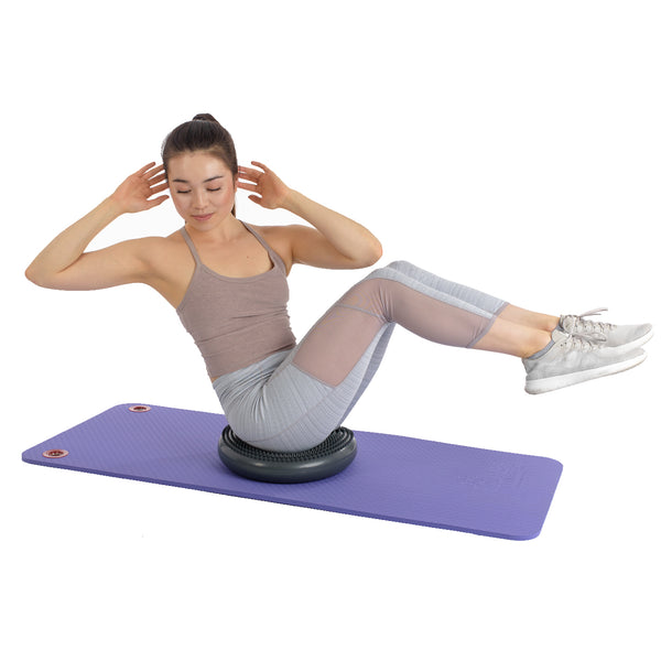 Woman using a balance pad for her workout