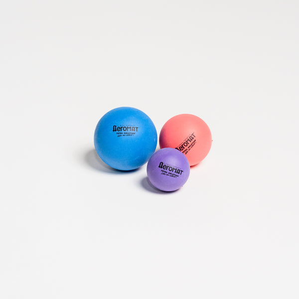 3 different colored therapy balls