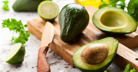 Avocado halves with lime