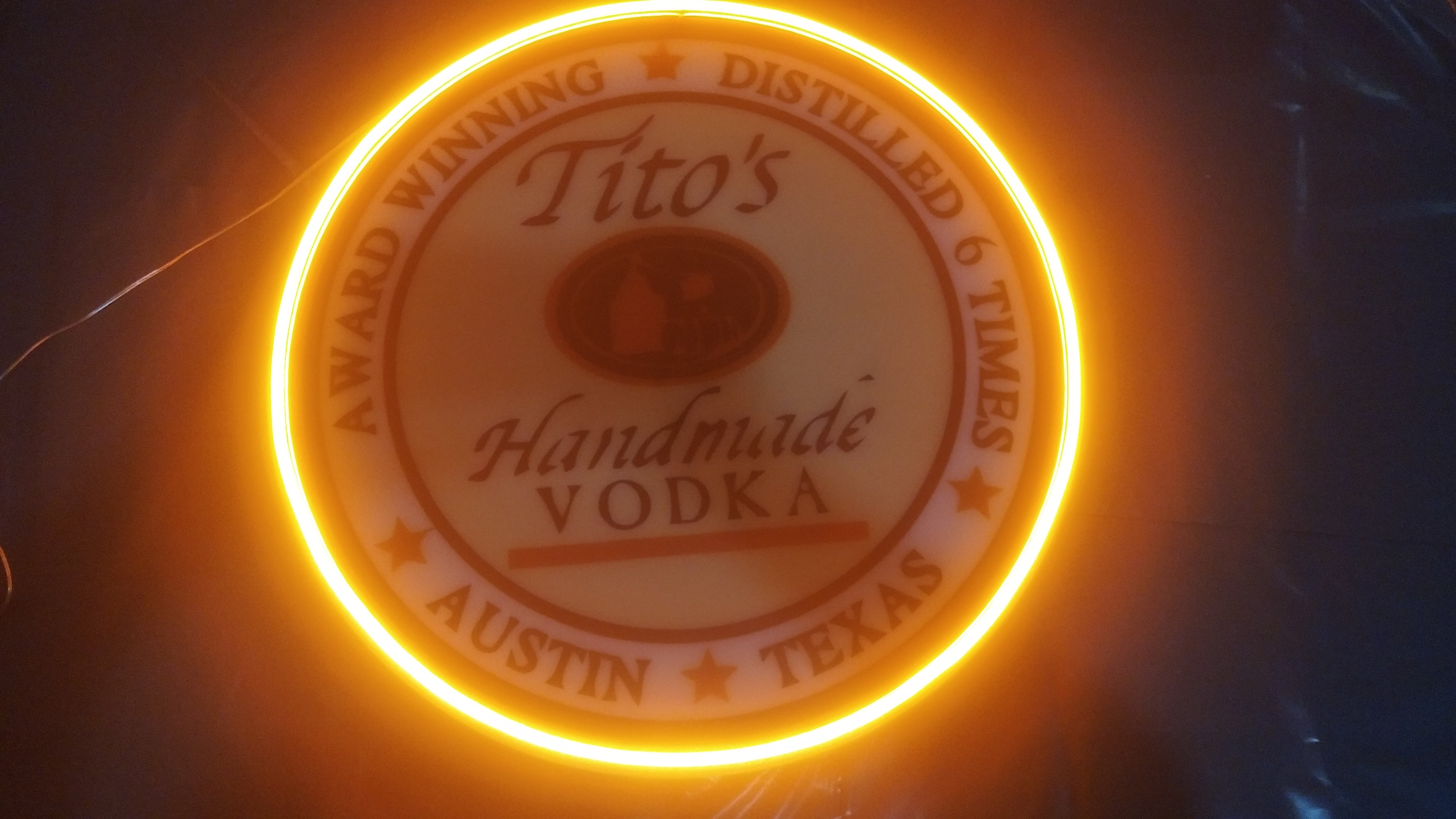 tito's neon sign for bar