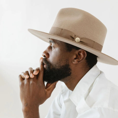 Man in a button-down wearing a tan fedora dress hat for men