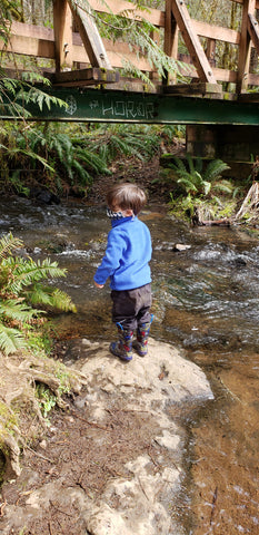 child by river