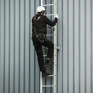 Man Climbing Fixed Ladder