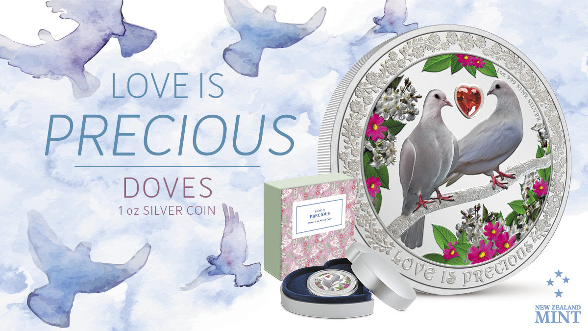 The 1oz silver coin features the two doves in the purest white colour, perched together on an engraved branch, and surrounded by blossoms. Between them is a red heart-shaped cubic zirconia. Around the edge the inscription Love is Precious is engraved.