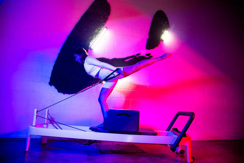 woman performing pilates at avenir los angeles studio