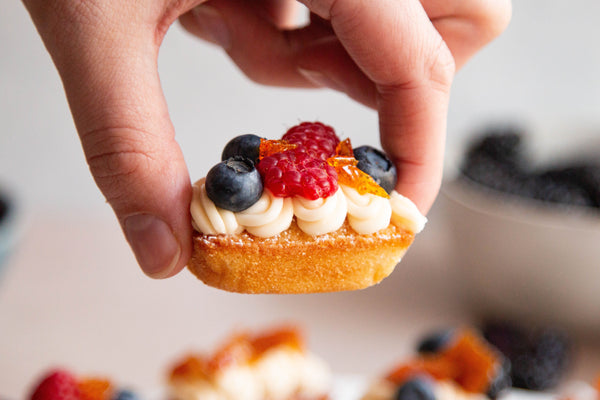 Almond Butter Cake topped with fruit and buttercream