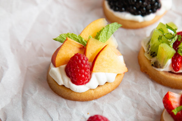 Raspberry Cookie Tarts with whipped cream and fruit