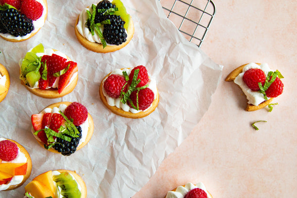 Raspberry Cookie Tarts with whipped cream and fruit