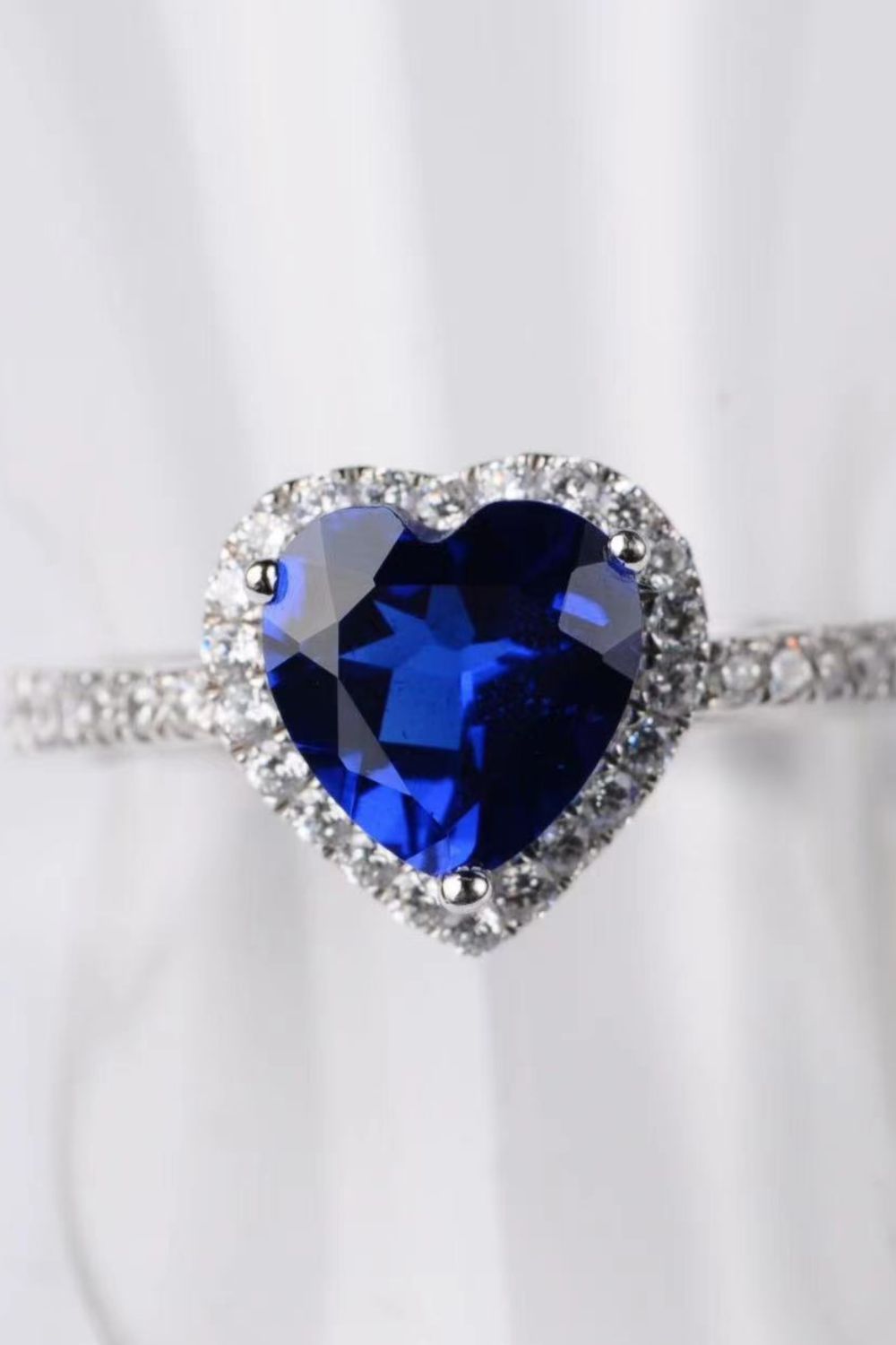 2-carat-moissanite-heart-shaped-side-stone-ring