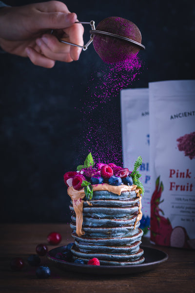 Butterfly Pea Flower Pancakes with Dragon Fruit Powder Topping