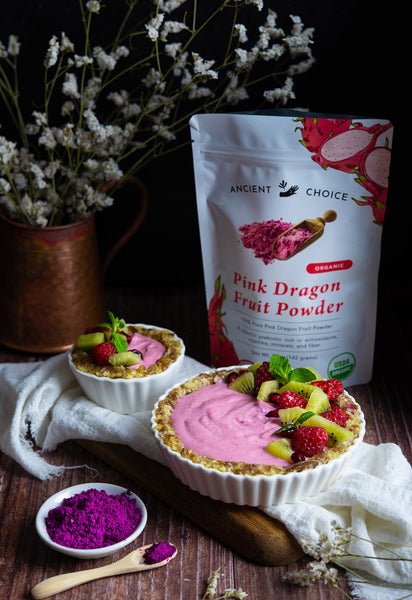 Dragon Fruit Tart made with red pitaya and decorated with fruit.