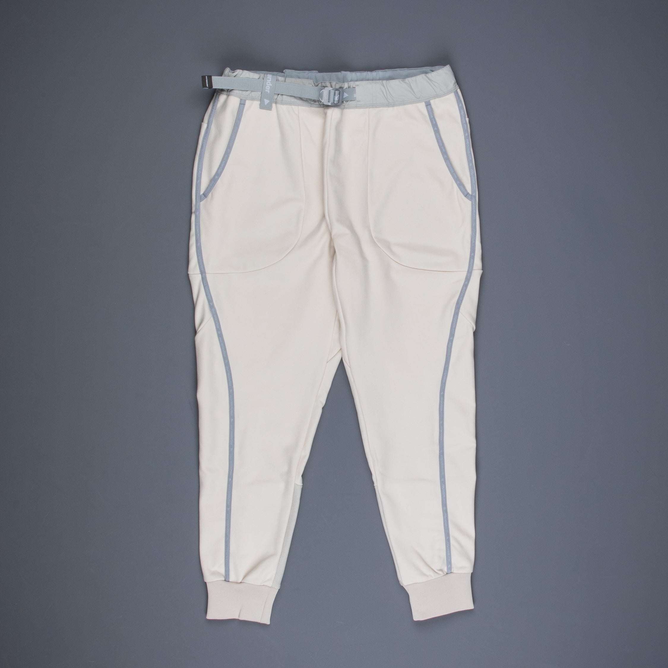 And Wander light fleece pants off white