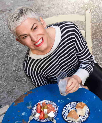 Eleni Psichouli with greek appetizers and ouzo