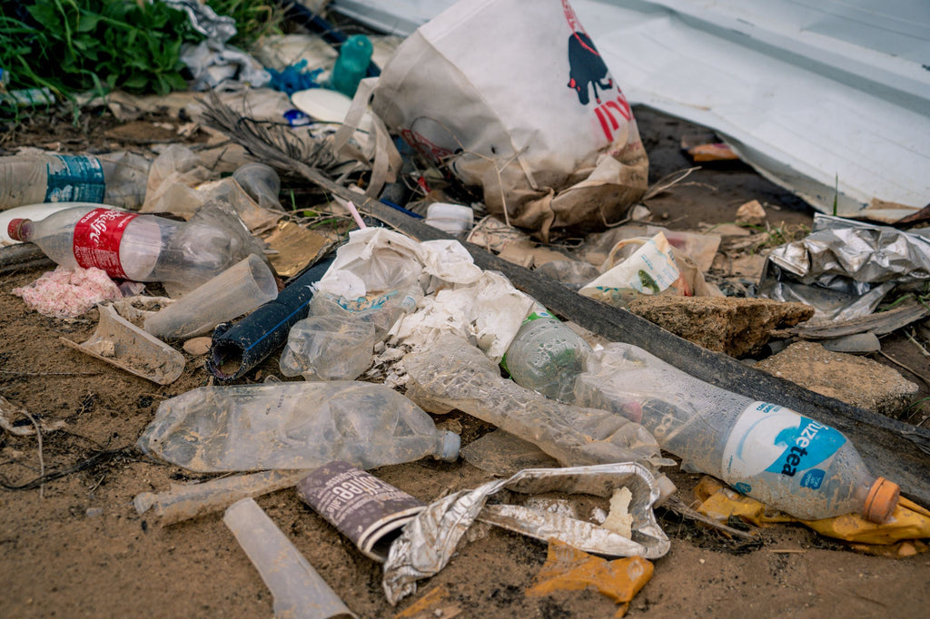 Loads of disguising plastic waste on a beach 