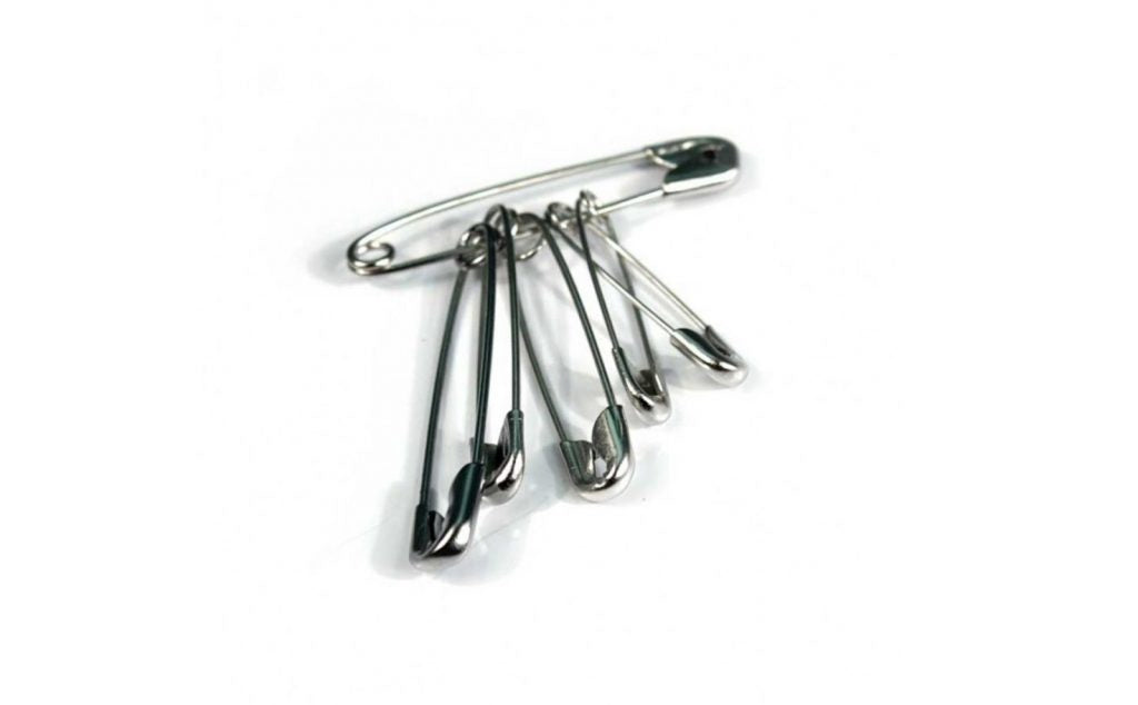 Six safety pins for first aid.