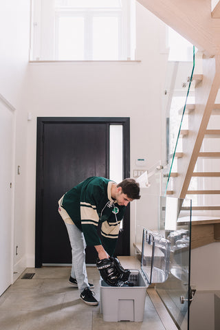 a man putting a sport equipment on Nutroz deodorizer device