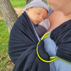 Baby fell asleep while being carried in a ring sling.