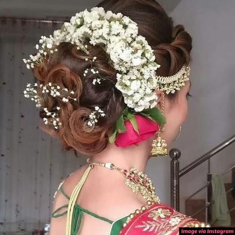 latestfloralbunindianreceptionbridalhairstyleforsaree  WedAbout