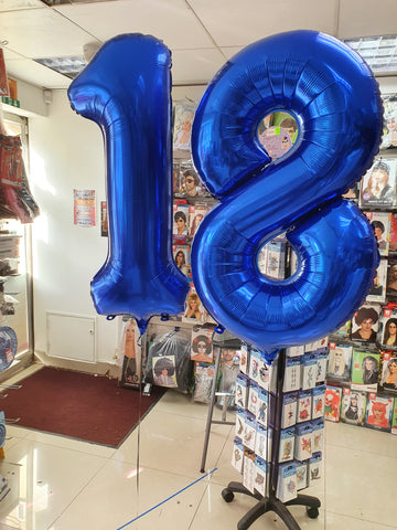 Blue number 1 and 8 foil balloons on weights