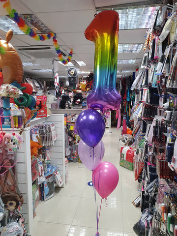 Rainbow number 1 foil balloon on a three balloon bouquet