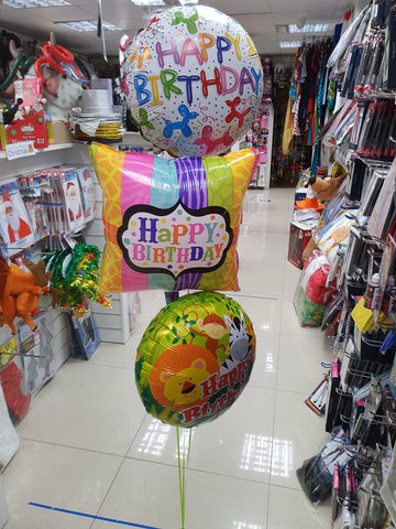 Three happy birthday foil balloons with weight