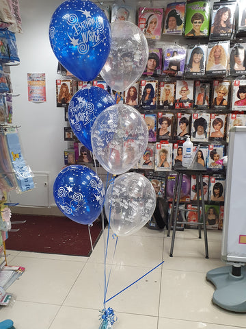Bunch of six printed blue & clear happy birthday balloons with blue table weight