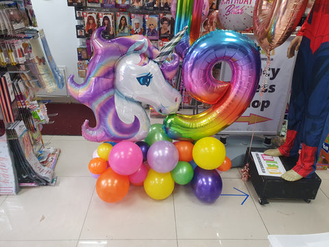 Rainbow Age Nine Unicorn balloon display