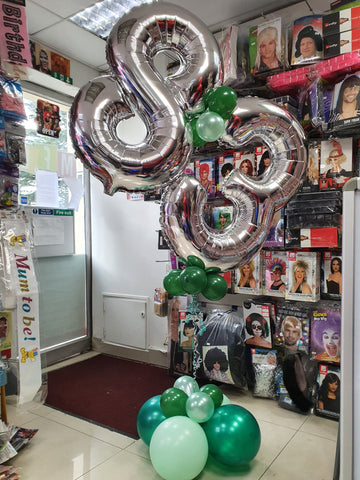 green and silver 83rd birthday balloons