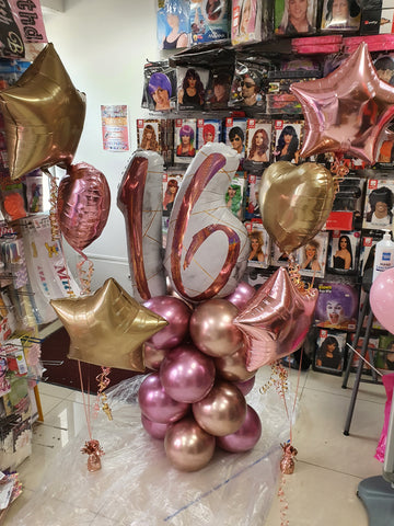 Rose gold and pink 16th birthday balloon display