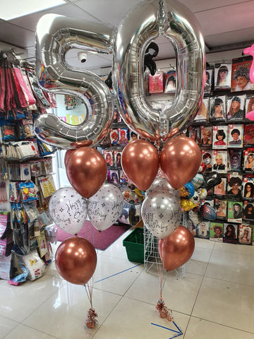 Silver and copper 50th birthday balloons.