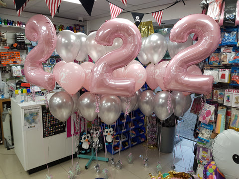 Pastel pink and white second birthday balloons