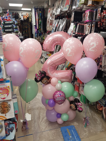 2nd Birthday pastel Minnie Mouse balloon stack with two five balloon bouquets